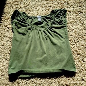 I am selling this mini green t- shirt. It’s a size large but fits tighter.
